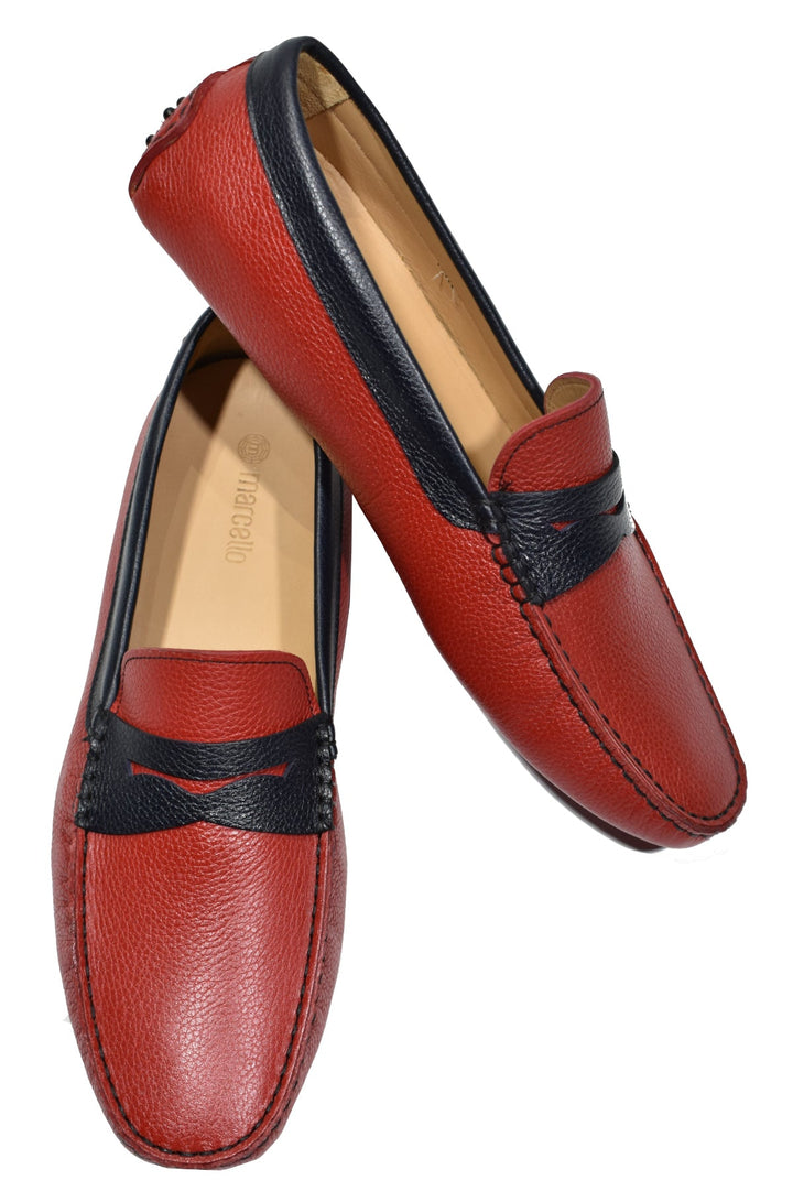 Take your look to the next level with the stylish S134 Red Driver shoes. Handcrafted in Spain with luxe red leather, navy leather trim and cool gommini soles, these shoes make a fashionable impression with their classic fit and comfortable foot bed. Perfect for any occasion. A great look with jeans or shorts.  Classic fit.