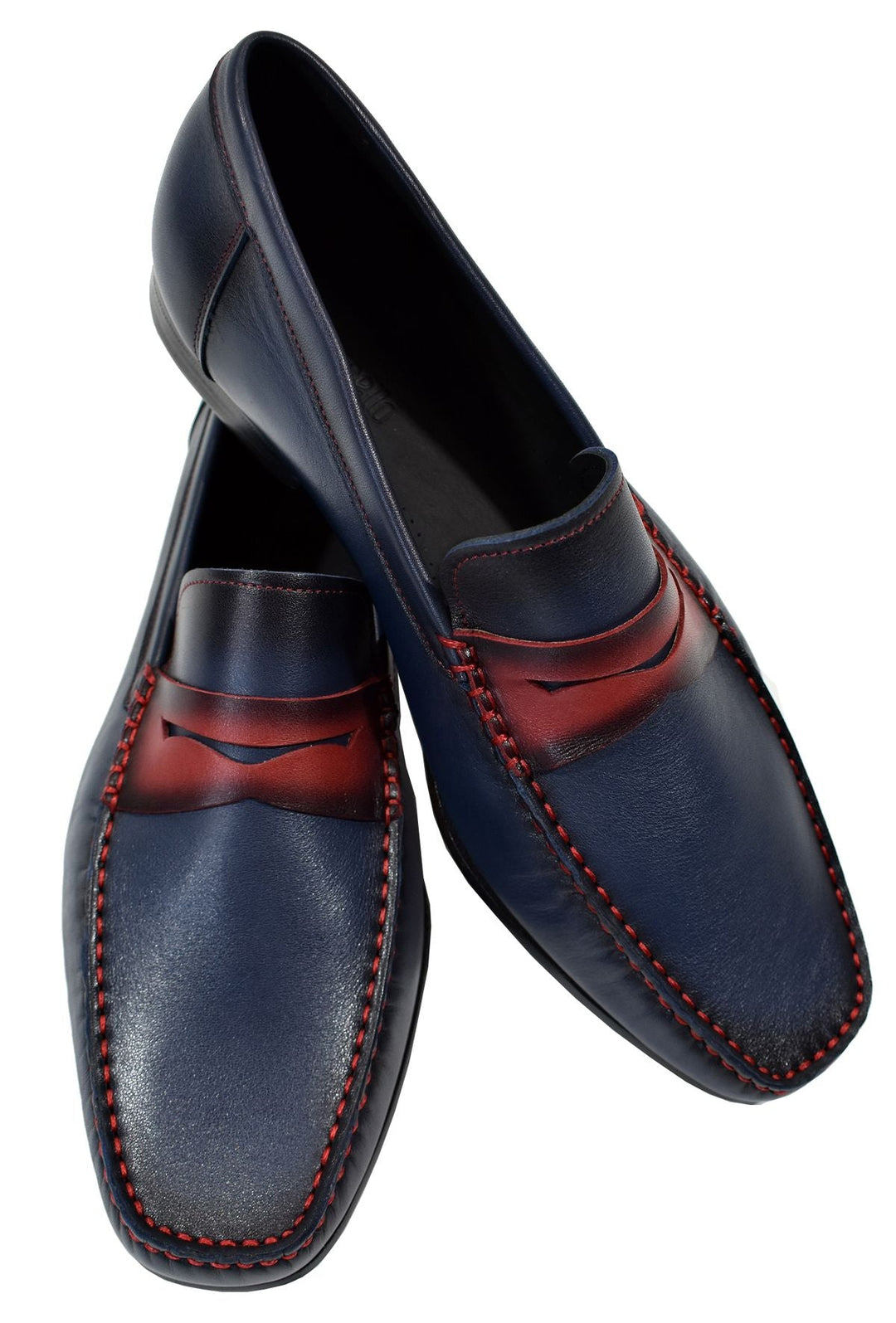 Add life and a hip look to your dress style with our burnished leather shoe in indigo with red accents.  Check out the cool matched red bottom and leather sole. Use this shoe for a casual or dress look to define classic style with an edge. Classic fit.  Hand crafted in Spain. Shoe by Marcello.